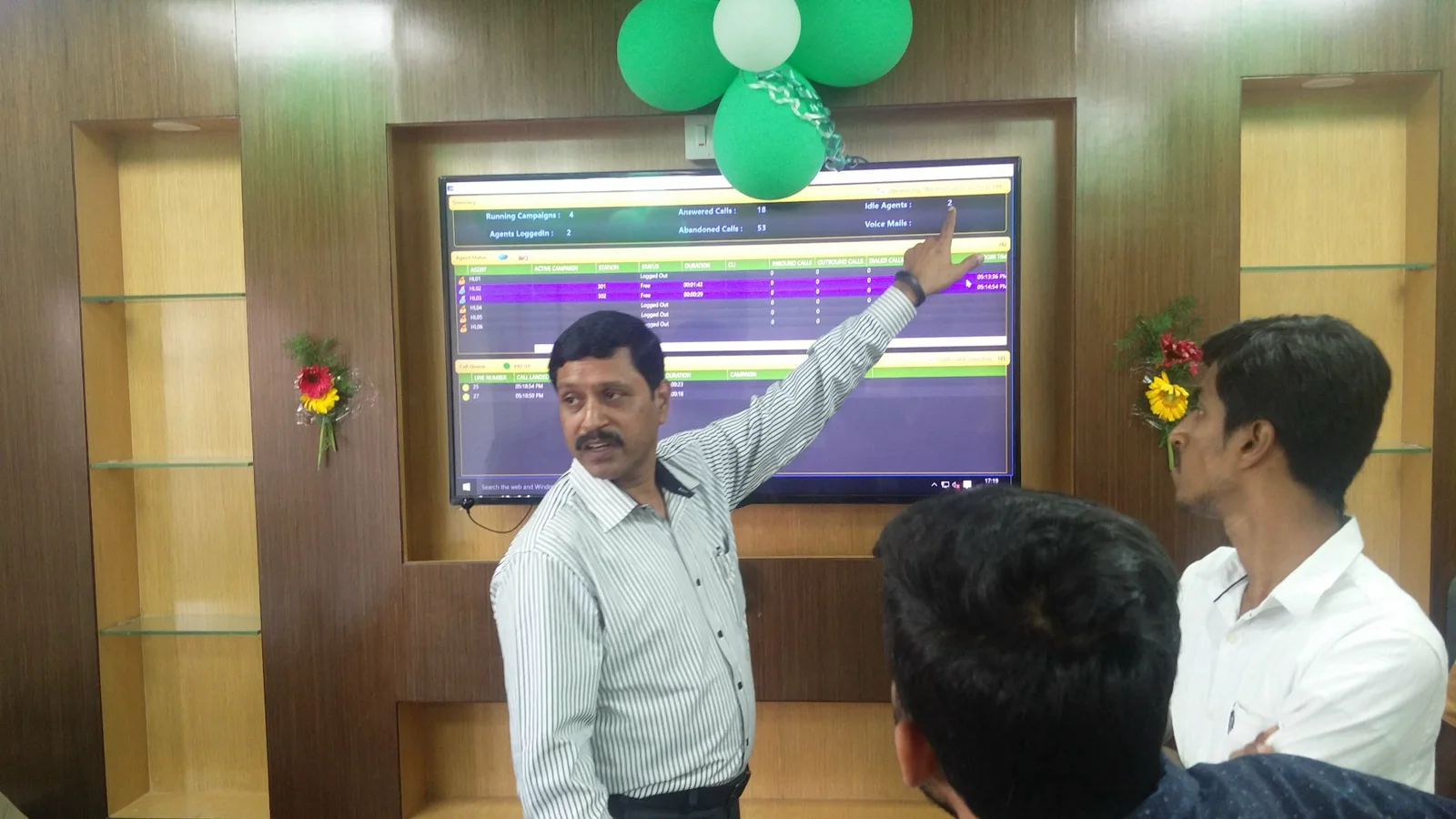 Axial Infotech IT operations and monitoring environment with a shared large-format display